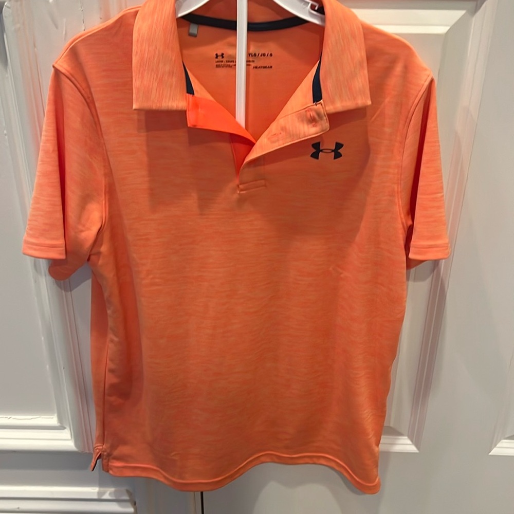 Like new under Armour size YLG loose-fitting polo in orange white